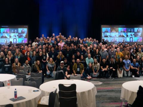Large group photo of Huntress team at its annual in-person Summer Summit.