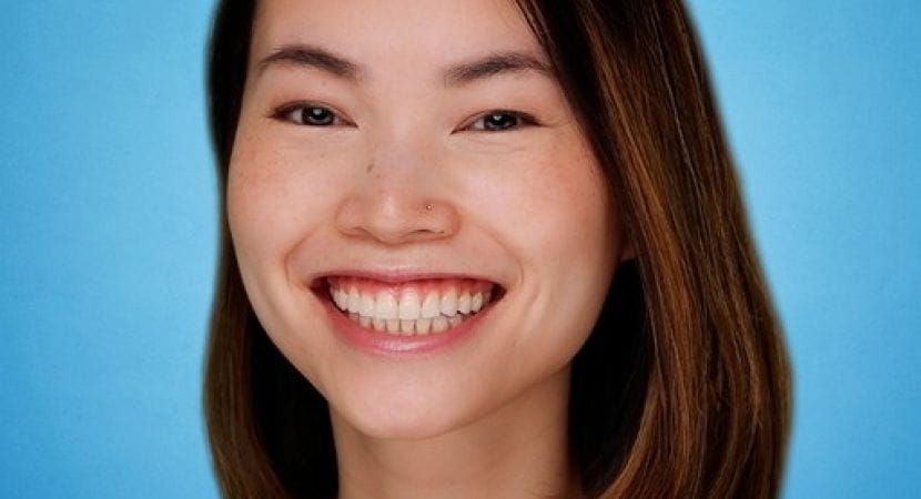 Headshot photo of Chi Vo against blue background