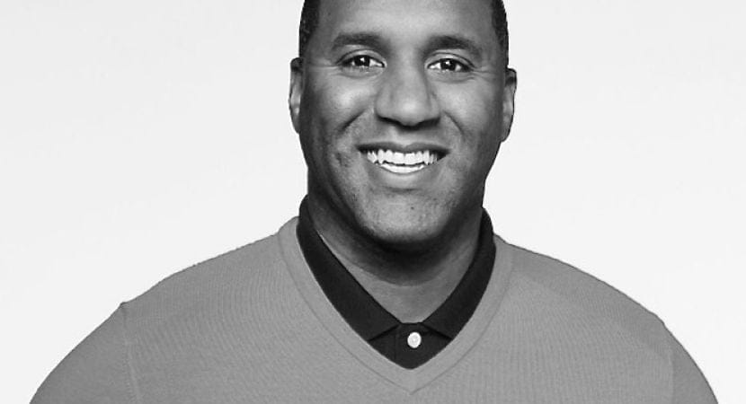 Headshot photo of Alex Mark, in black and white