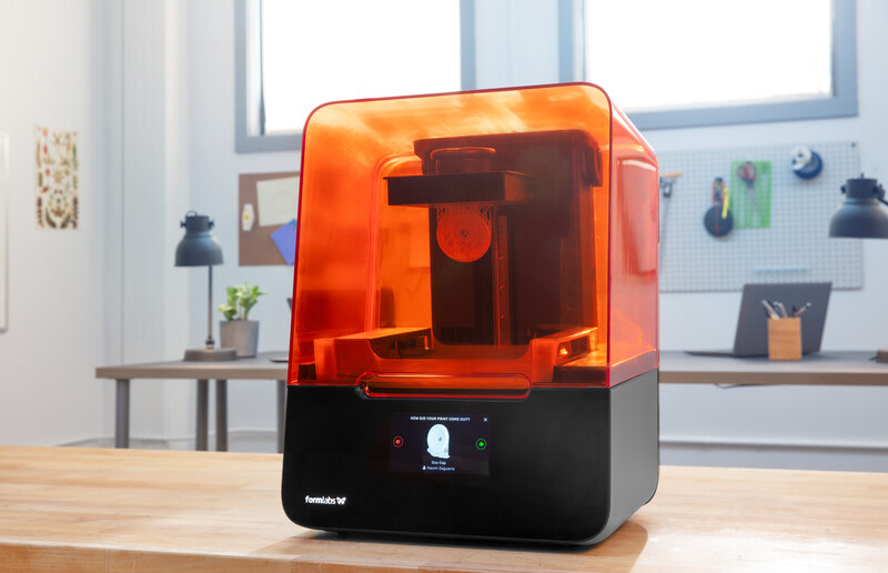 A Formlabs 3D printer sits on a table. 