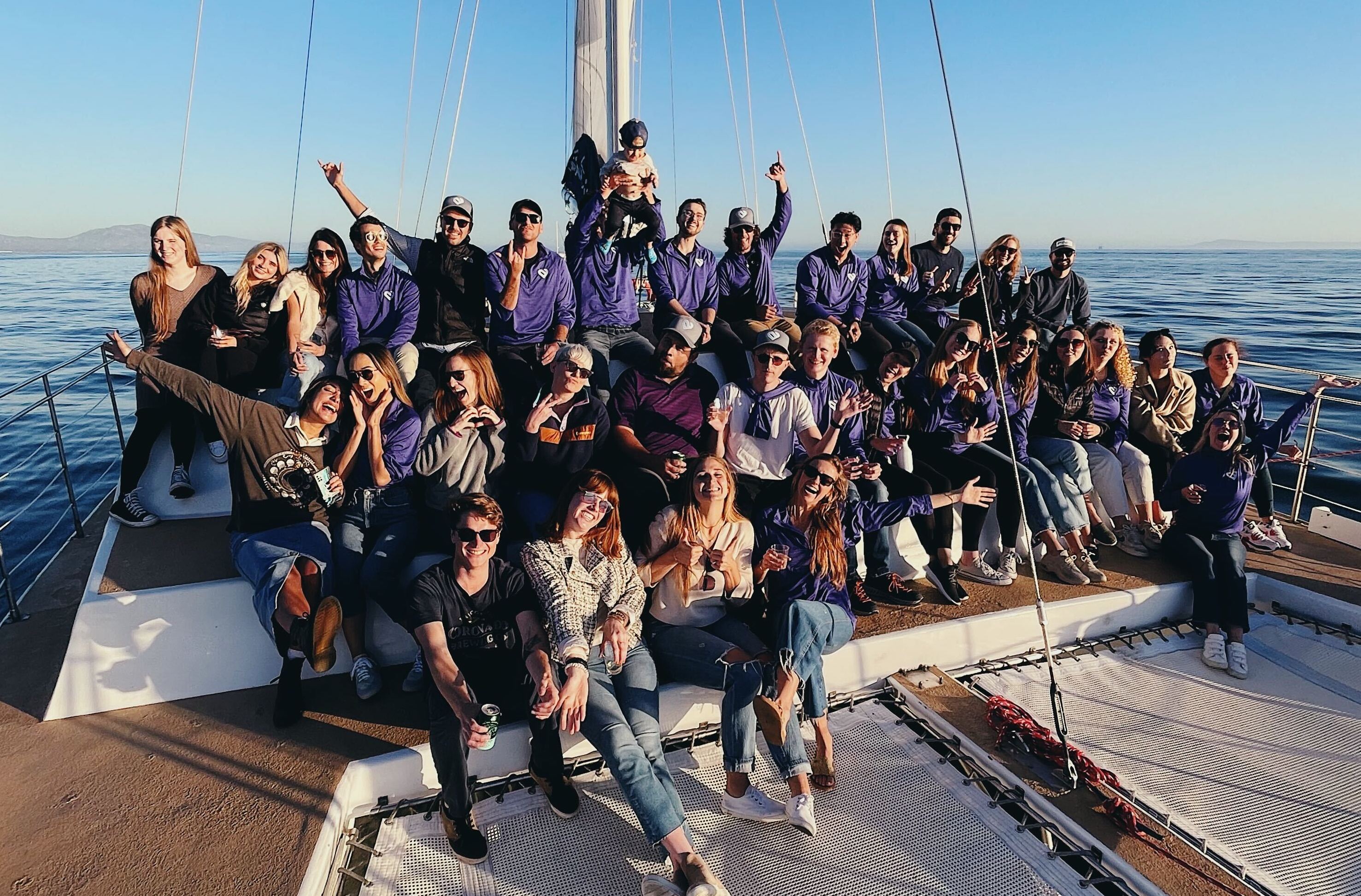 group photo of artera team on a boat