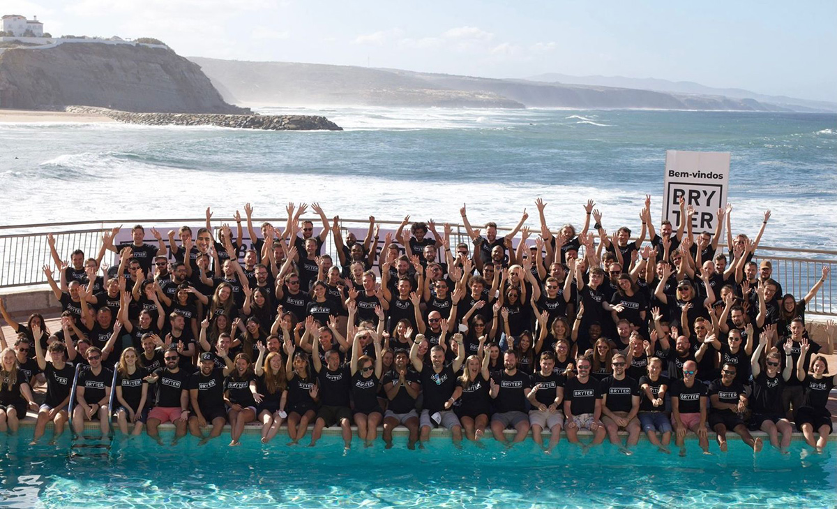 BRYTER team photo at a swimming pool by the ocean