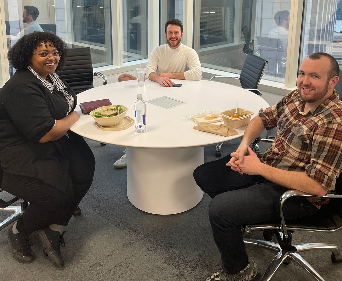 BitSight team members eating lunch together in the office break room