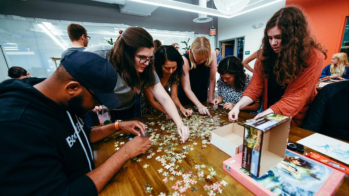 BookBub employees bond as a team over puzzles and other activities during Cat Chats.