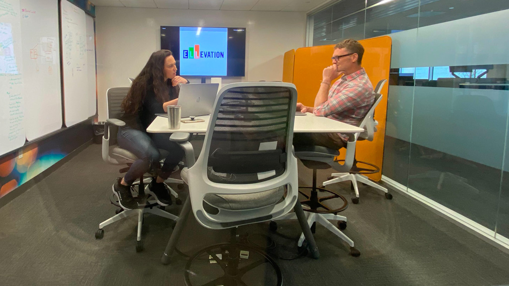 Two people having a meeting in the Ellevation Education office