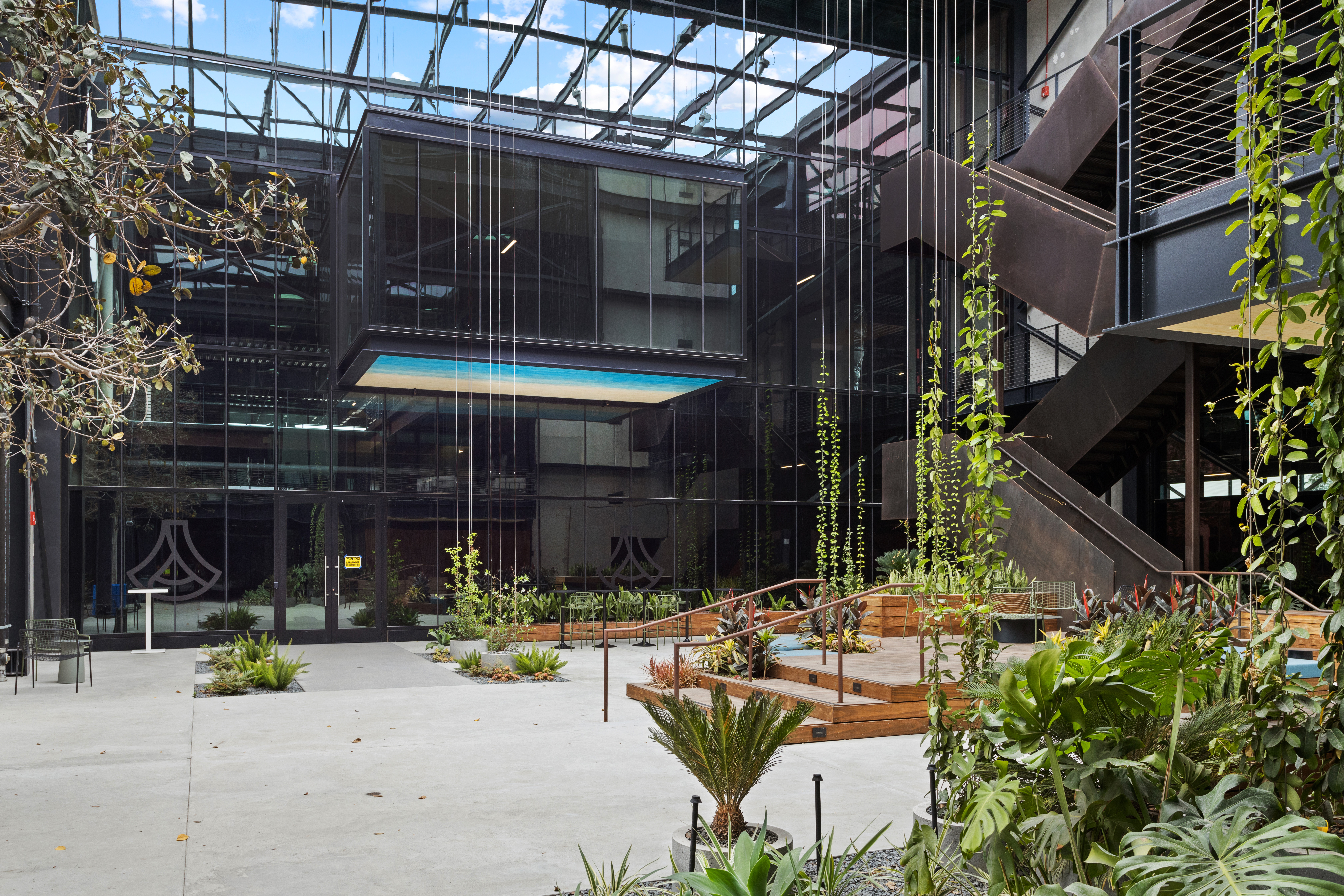 Photo of a covered courtyard with greenery at Anduril's headquarters