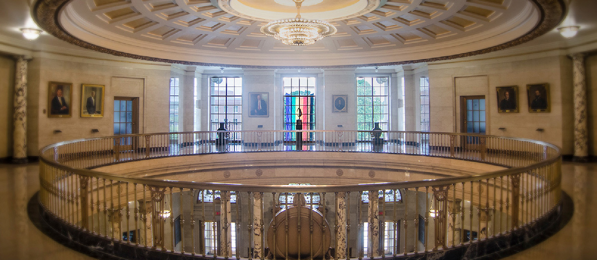 The rotunda at the MassMutual office with a pride flag hanging in the window