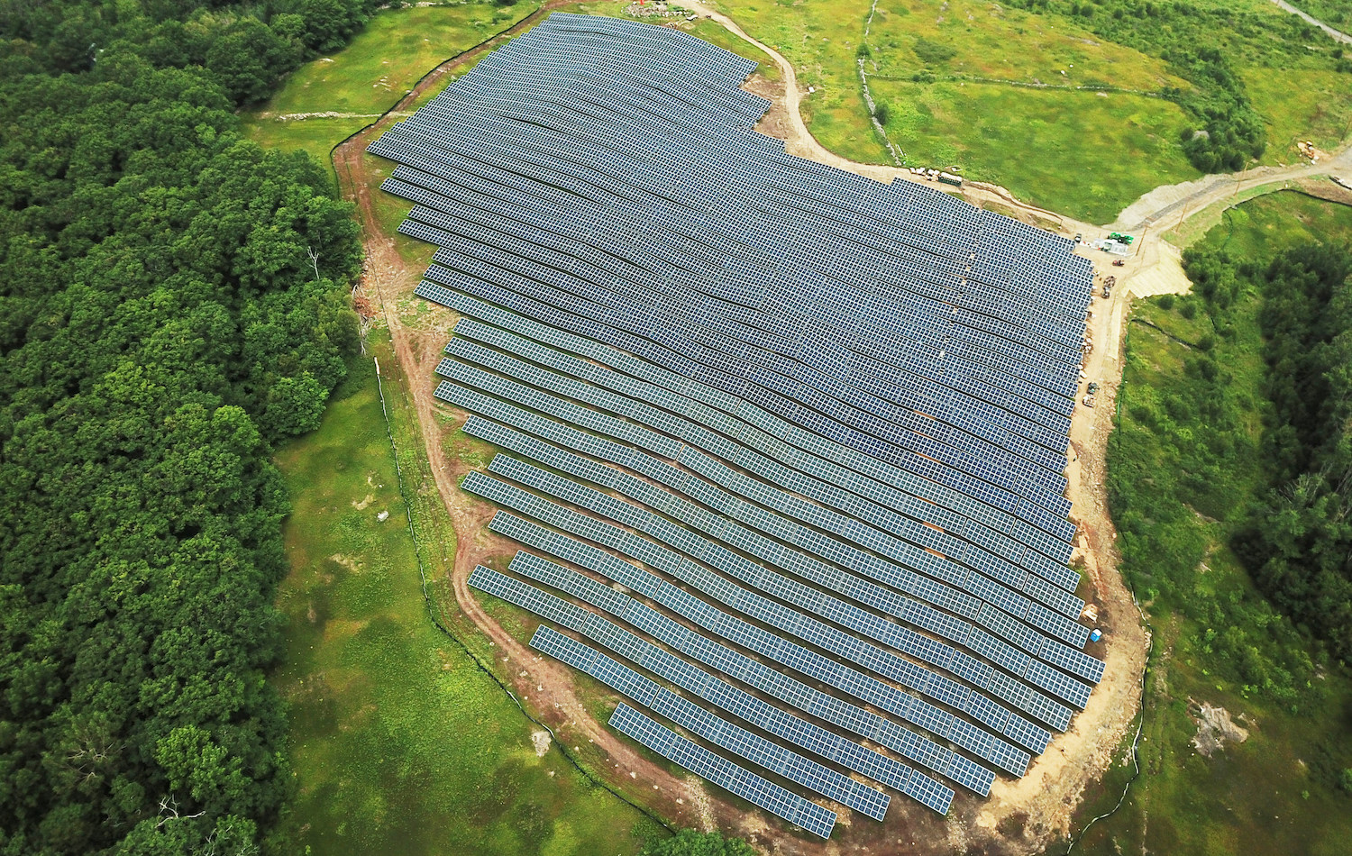 An aerial photograph of an agrivoltaic project in Rockport, Maine