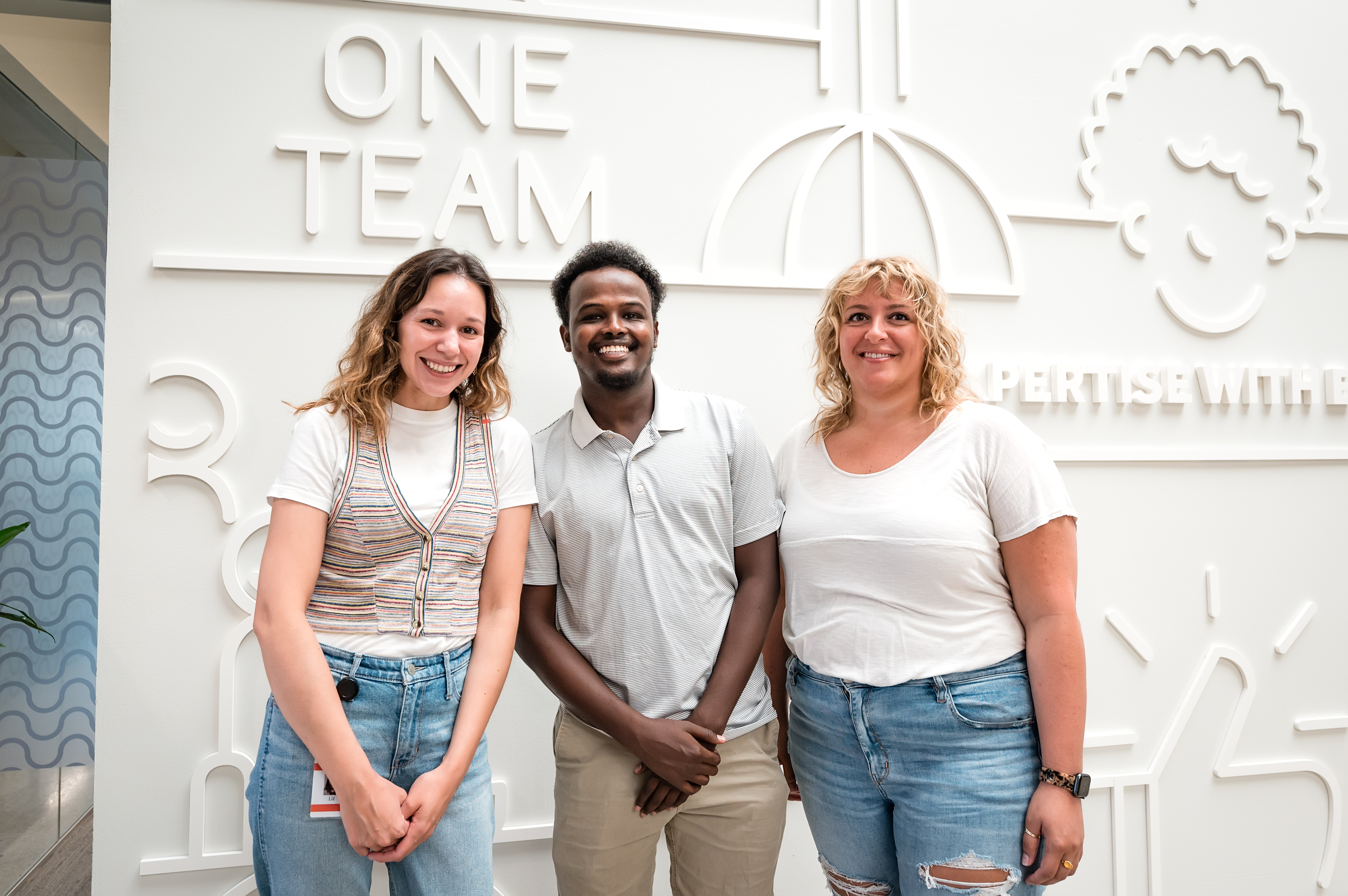 Toast team photo of two women and one man