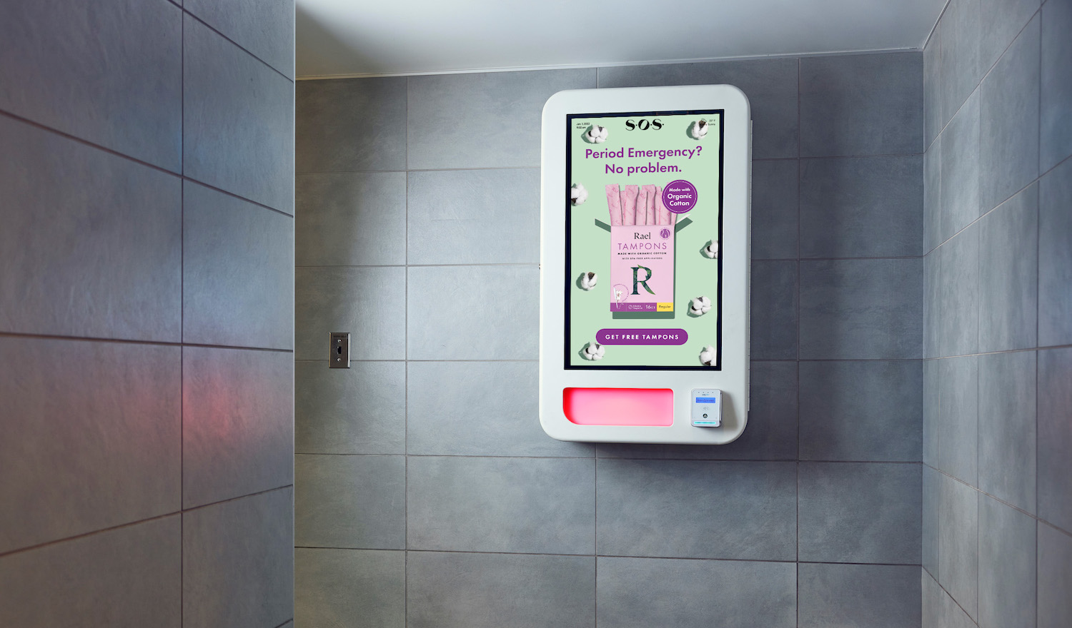 An ad for Rael tampons is displayed on a SOS vending machine in a bathroom.