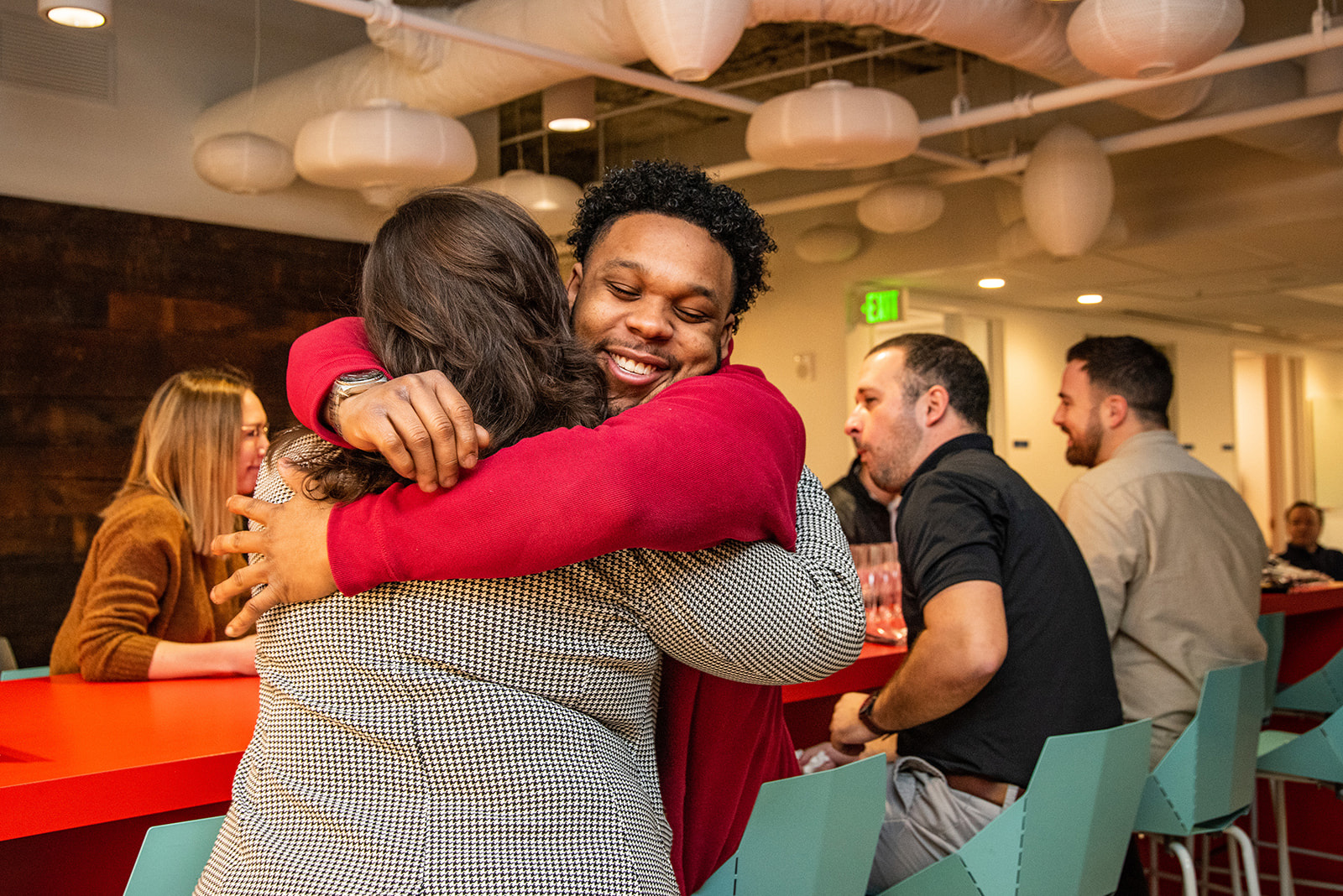 Two connectRN team members hugging in the office
