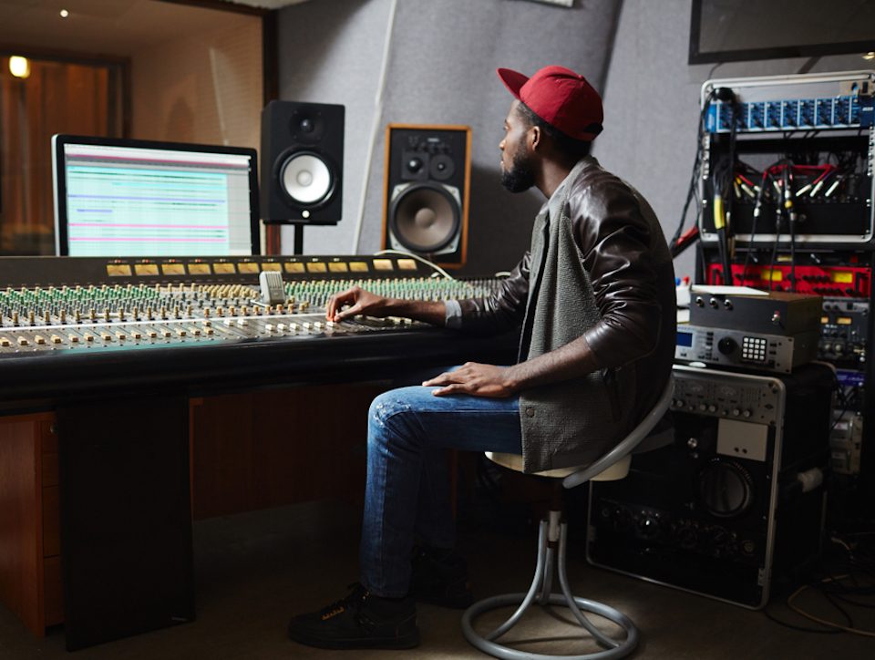 Man in recording studio - iZotope