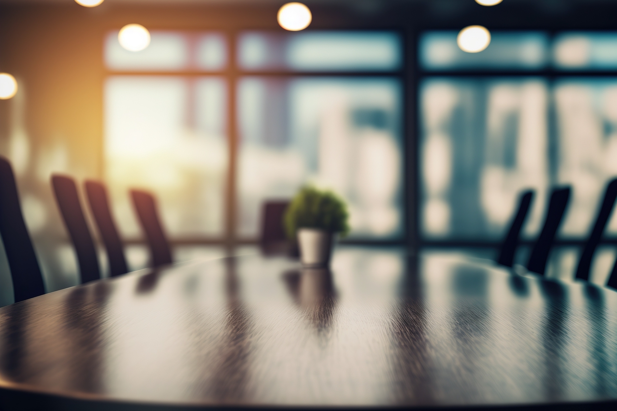 A blurry photo of a boardroom is pictured.