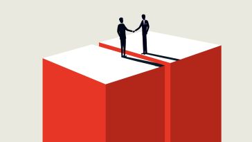 Two figures in business attire shake hands atop red and white boxes