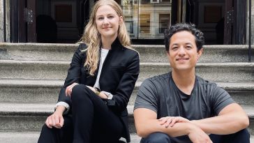 Perygee co-founders Mollie Breen, CEO, (left) and Mark Watabe, CTO, (right) sitting on the steps outside of a building.