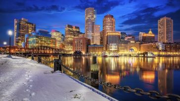 The Boston skyline reflects on the harbor