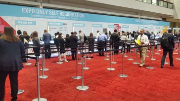 Attendees line up to register for an event