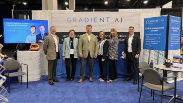 The Gradient AI Team at a conference booth