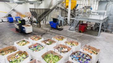Several boxes of expired food are pictured inside Divert's anaerobic digestion facility in Freetown.