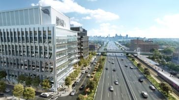 A rendering of the 176 Lincoln development on the north side of I-90 with downtown Boston pictured in the distance.