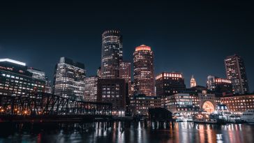 Boston skyline from the harbor at night.