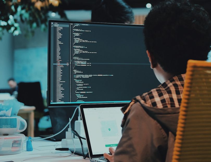 A software developer writing code