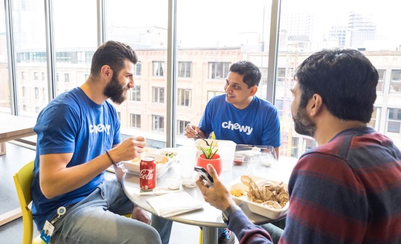 Chewy team members eating and chating