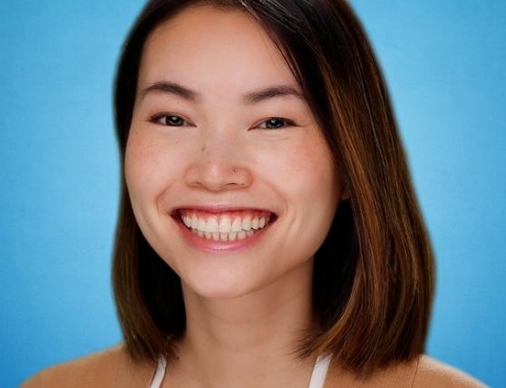 Headshot photo of Chi Vo against blue background
